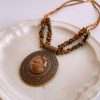 0d2eeda3-ab69-4530-8b59-d964f7562657_fine.jpeg Irregular Tiger Eye Stone Oval Pendant Necklace With Retro And Antique Style