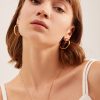 French minimalist circle ear buckle