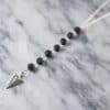 Volcanic stone arrow sweater necklace