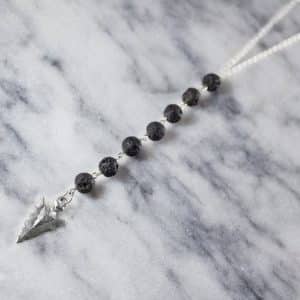 Volcanic stone arrow sweater necklace