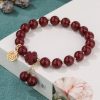 Retro Simple Women's High-content Purple Gold Sand Fu Character Peach Blossom Tassel Bracelet
