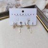 8868030e-fcd9-4460-86c7-185e72fce25c.jpg Feather Octagonal Star Ear Clip Pendant Set